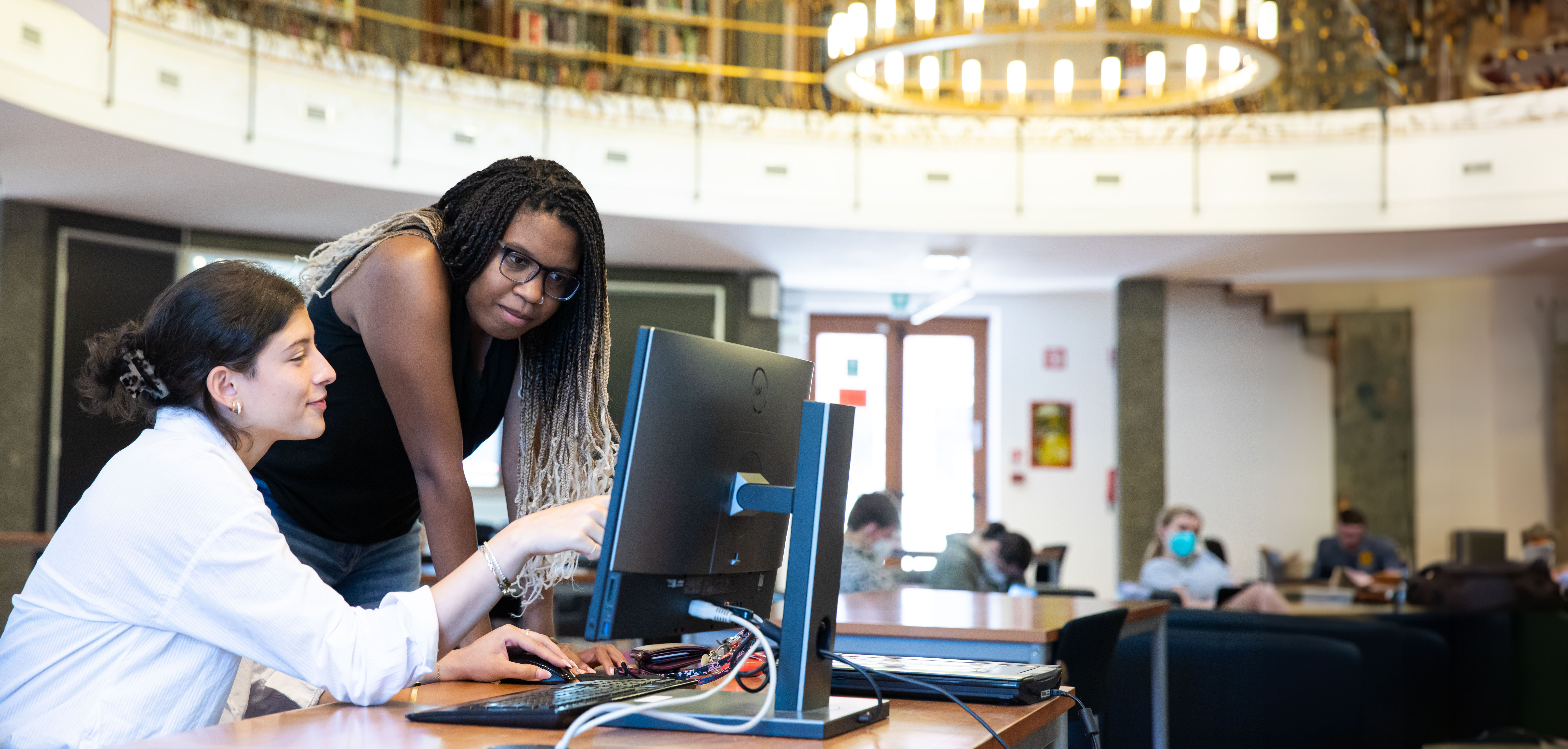 two woman at a computer