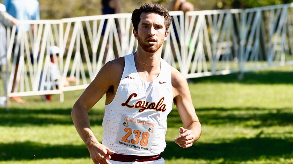 Ryan Martin runs during a race for the Loyola cross country team