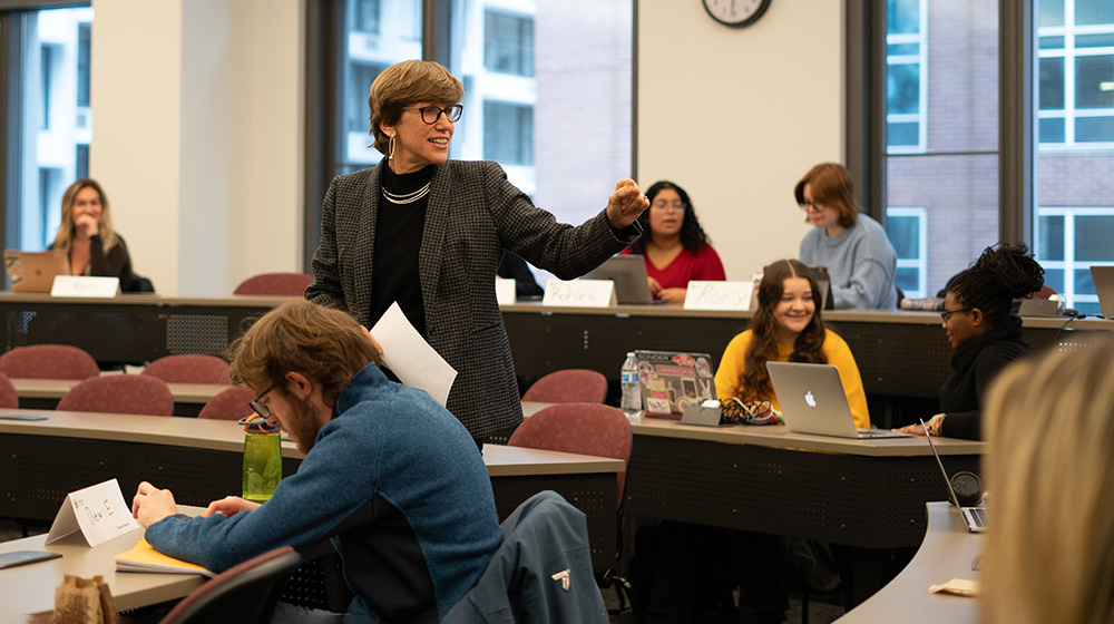 Jennifer Griffin stands and teaches to students in a classroom at Schreiber Center.