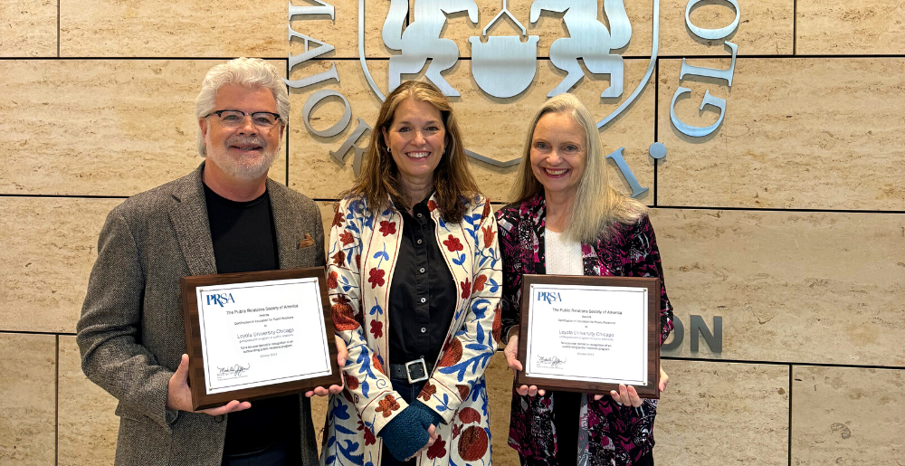 Associate Professor David Kamerer, Program Director of the GSC program, and Associate Professor Pamela Morris, Program Director of Advertising and Public Relations, jointly receive the SOC’s PRSA certification with the support of Interim Dean Elizabeth Coffman.